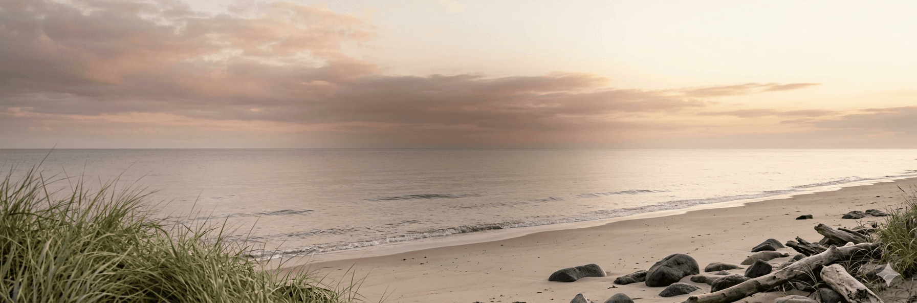 Peaceful ocean shoreline at sunrise